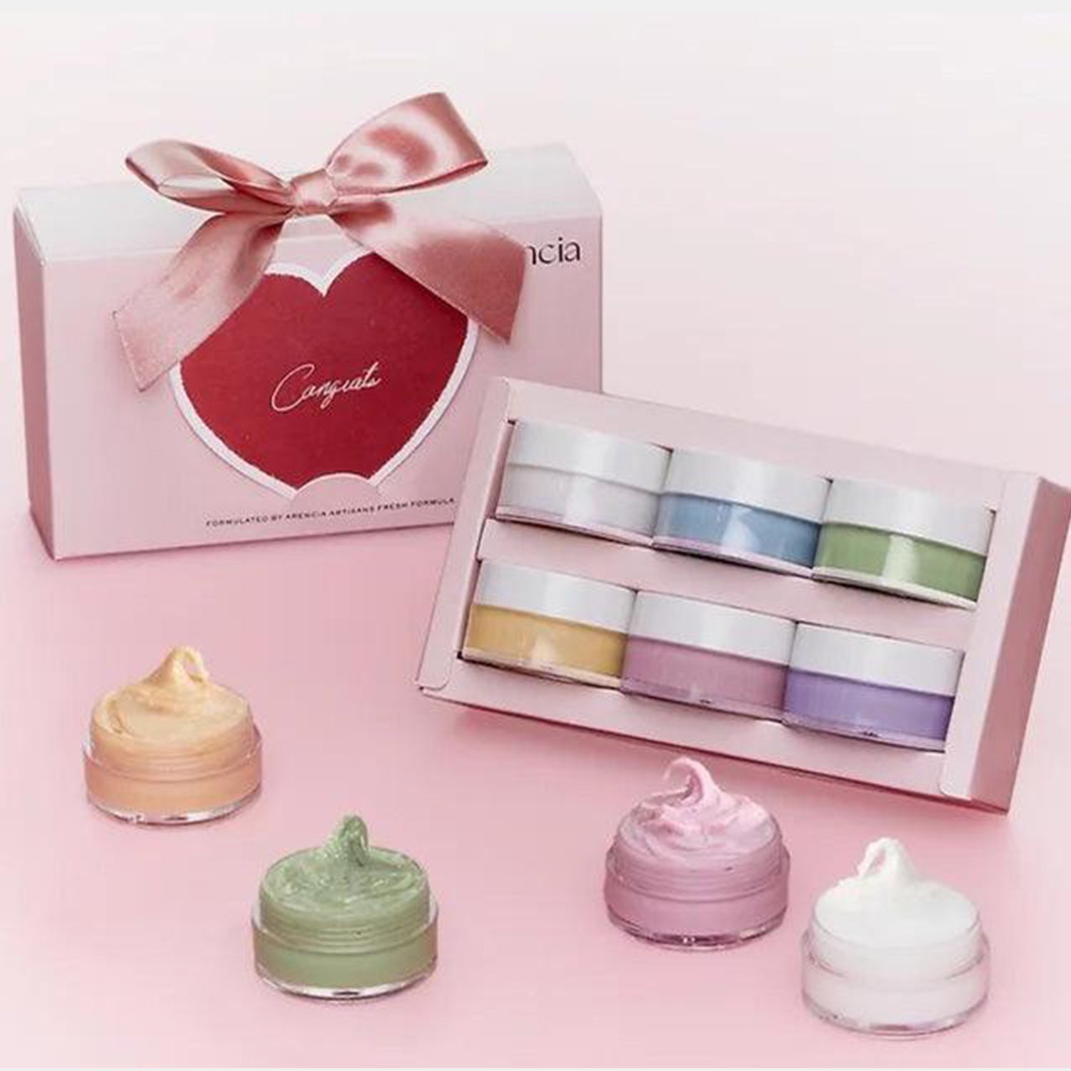 Set of small jars with colorful contents in front of a pink box with a bow, on a pink background. Arencia 6PCS Discovery Kit asian authentic genuine original korean skincare montreal toronto calgary canada thekshop thekshop.ca natural organic vegan cruelty-free cosmetics kbeauty vancouver free shipping clean beauty routine skin makeup kpop stayz stan fandom photocard stray kids treasure ateez atiny dix30 brossard ddo royal mount st-bruno new store
