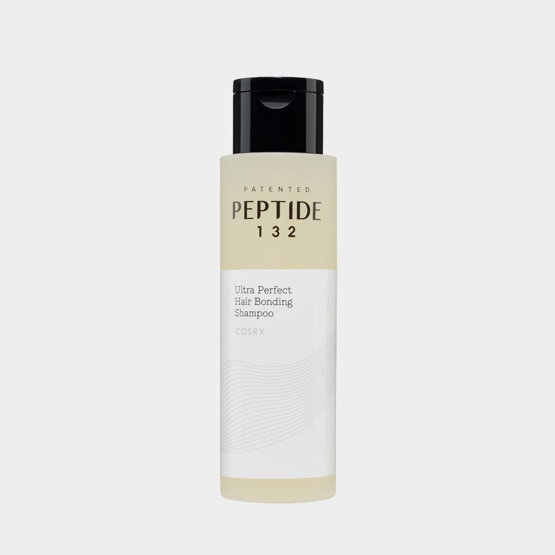Shampoo bottle labeled 'Peptide 132' on a light gray background COSRX PEPTIDE-132 Ultra Perfect Hair Bonding Shampoo asian authentic genuine original korean skincare montreal toronto calgary canada thekshop thekshop.ca natural organic vegan cruelty-free cosmetics kbeauty vancouver free shipping clean beauty routine skin makeup kpop stayz stan fandom photocard stray kids treasure ateez atiny dix30 brossard ddo royal mount st-bruno new store