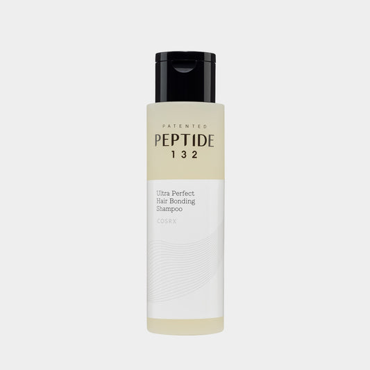 Shampoo bottle labeled 'Peptide 132' on a light gray background COSRX PEPTIDE-132 Ultra Perfect Hair Bonding Shampoo asian authentic genuine original korean skincare montreal toronto calgary canada thekshop thekshop.ca natural organic vegan cruelty-free cosmetics kbeauty vancouver free shipping clean beauty routine skin makeup kpop stayz stan fandom photocard stray kids treasure ateez atiny dix30 brossard ddo royal mount st-bruno new store
