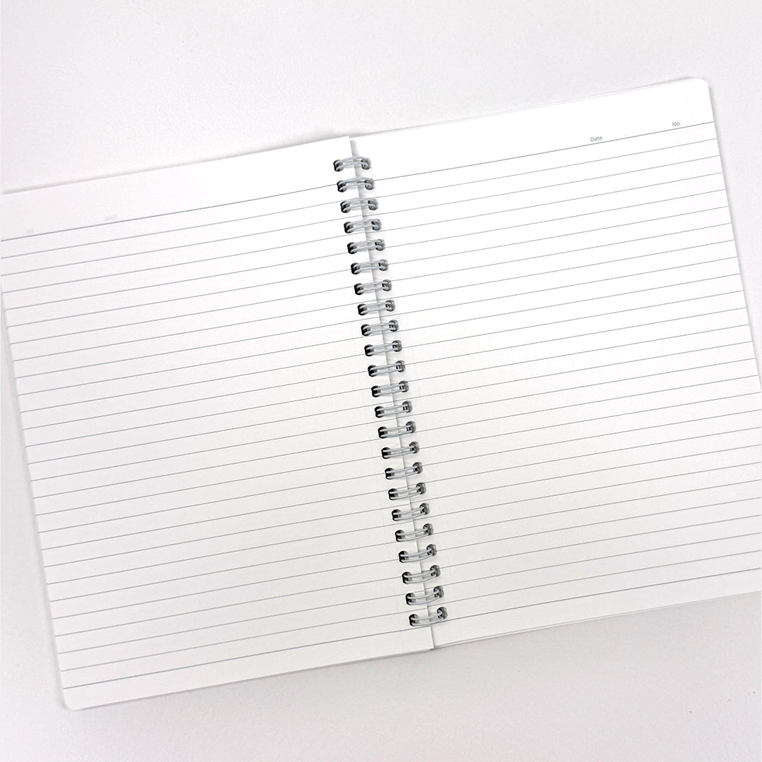 Open spiral-bound notebook with lined pages on a white background. Disney Mickey Mouse Spiral Notebook Classic Character Silhouette Design Official Disney Stationery Canada.