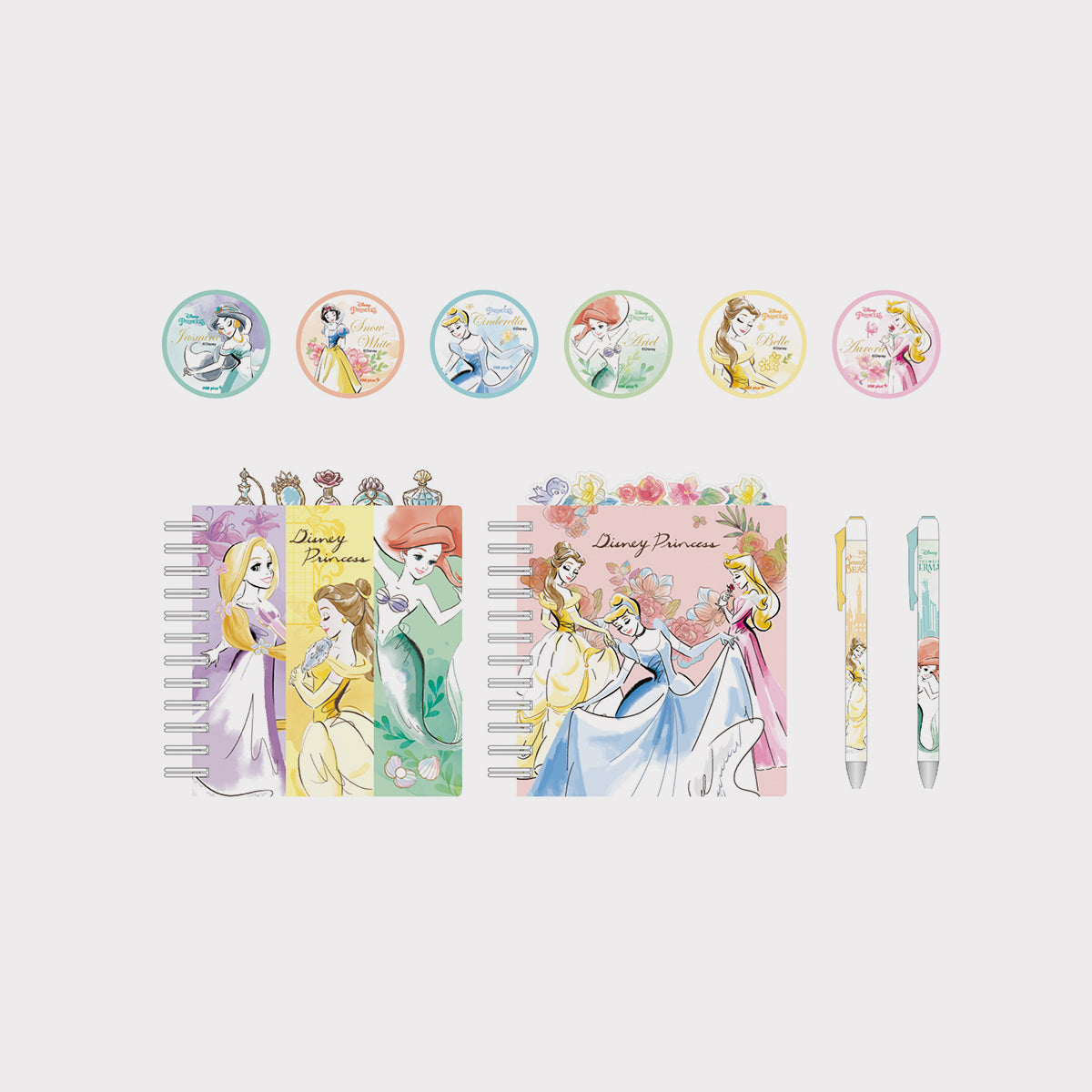 Official Disney Princess-themed stationery merch items including notebooks and pens on a light gray background.