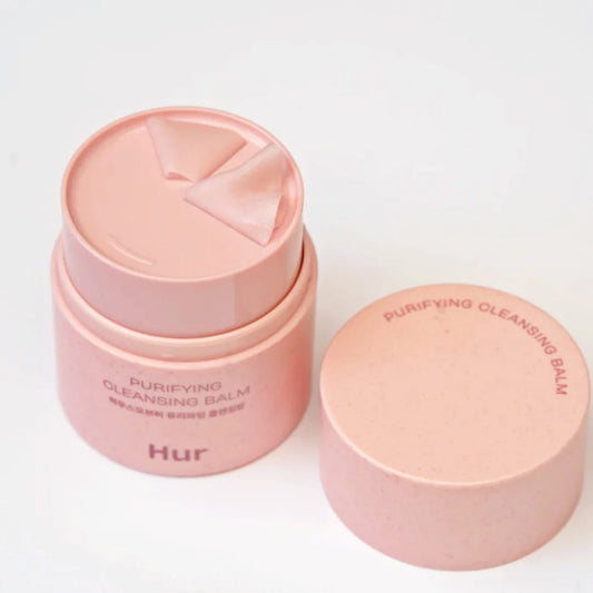 Pink cleansing balm container with 'HUR' branding on a white background asian authentic genuine original korean skincare montreal toronto calgary canada thekshop thekshop.ca natural organic vegan cruelty-free cosmetics kbeauty vancouver free shipping clean beauty routine skin makeup kpop stayz stan fandom photocard stray kids treasure ateez atiny dix30 brossard ddo royal mount st-bruno new store