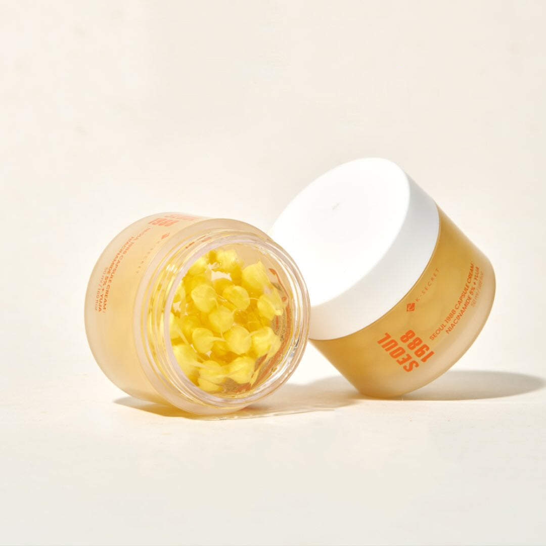 Two jars of BB cream with one open showing yellow beads on a light background KSECRET SEOUL 1988 Capsule Cream Niacinamide 5% + Yuja asian authentic genuine original korean skincare montreal toronto calgary canada thekshop thekshop.ca natural organic vegan cruelty-free cosmetics kbeauty vancouver free shipping clean beauty routine skin makeup kpop stayz stan fandom photocard stray kids treasure ateez atiny dix30 brossard ddo royal mount st-bruno new store