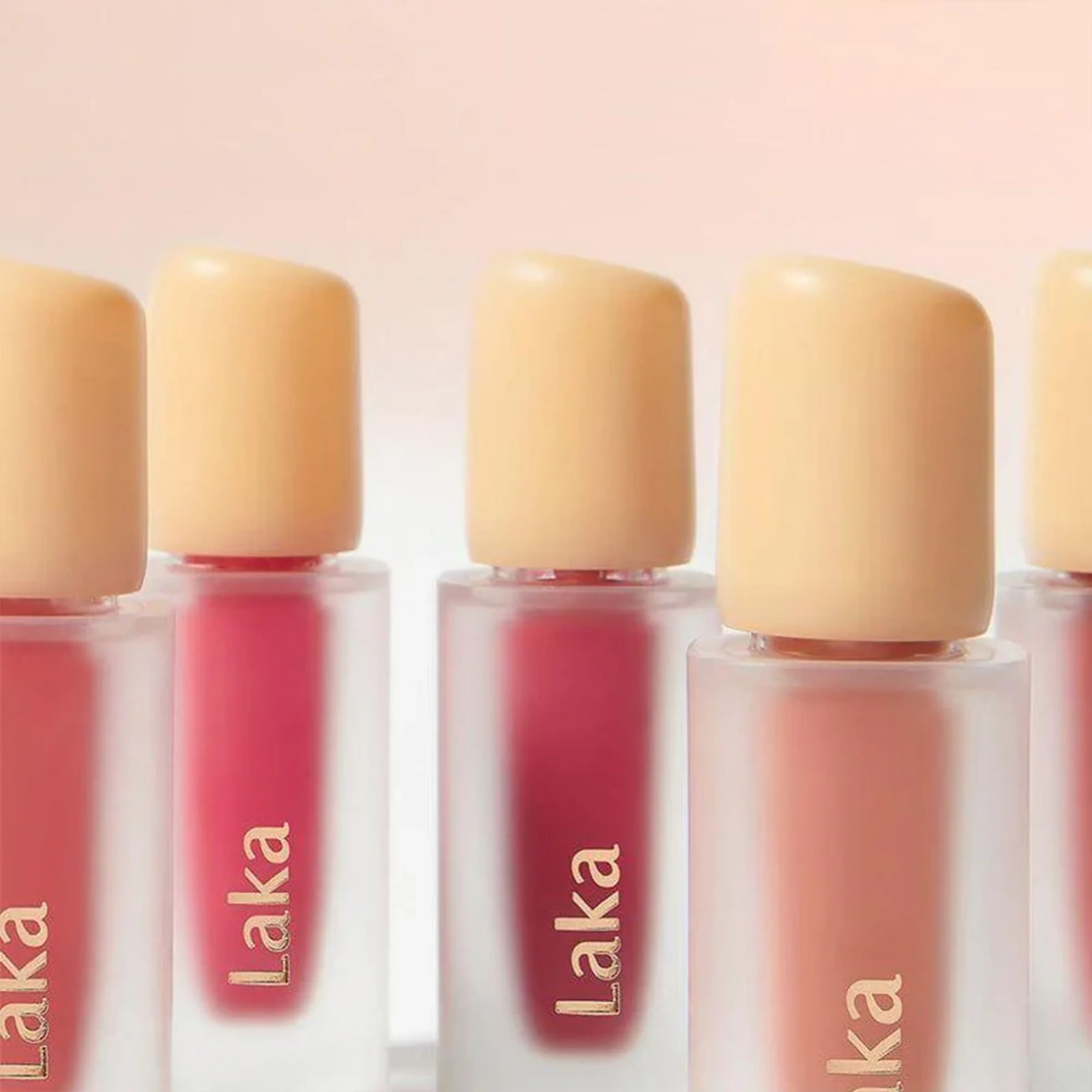 Laka lip gloss bottles with beige caps on a light pink background Laka Fruity Glam Tint asian authentic genuine original korean skincare montreal toronto calgary canada thekshop thekshop.ca natural organic vegan cruelty-free cosmetics kbeauty vancouver free shipping clean beauty routine skin makeup kpop stayz stan fandom photocard stray kids treasure ateez atiny dix30 brossard ddo royal mount st-bruno new store
