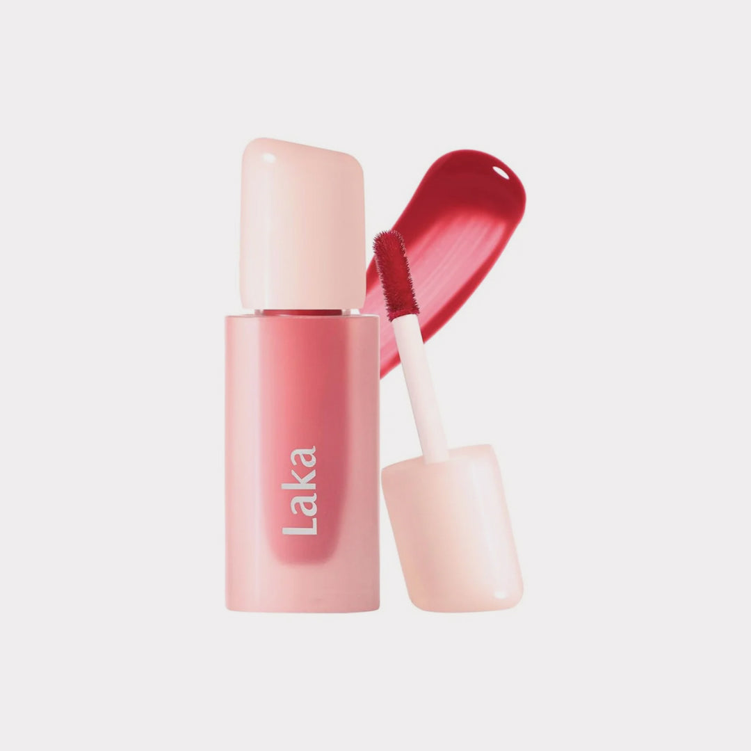 Laka lip gloss with applicator on a light gray background Laka Popping Balloon Tint asian authentic genuine original korean skincare montreal toronto calgary canada thekshop thekshop.ca natural organic vegan cruelty-free cosmetics kbeauty vancouver free shipping clean beauty routine skin makeup kpop stayz stan fandom photocard stray kids treasure ateez atiny dix30 brossard ddo royal mount st-bruno new store