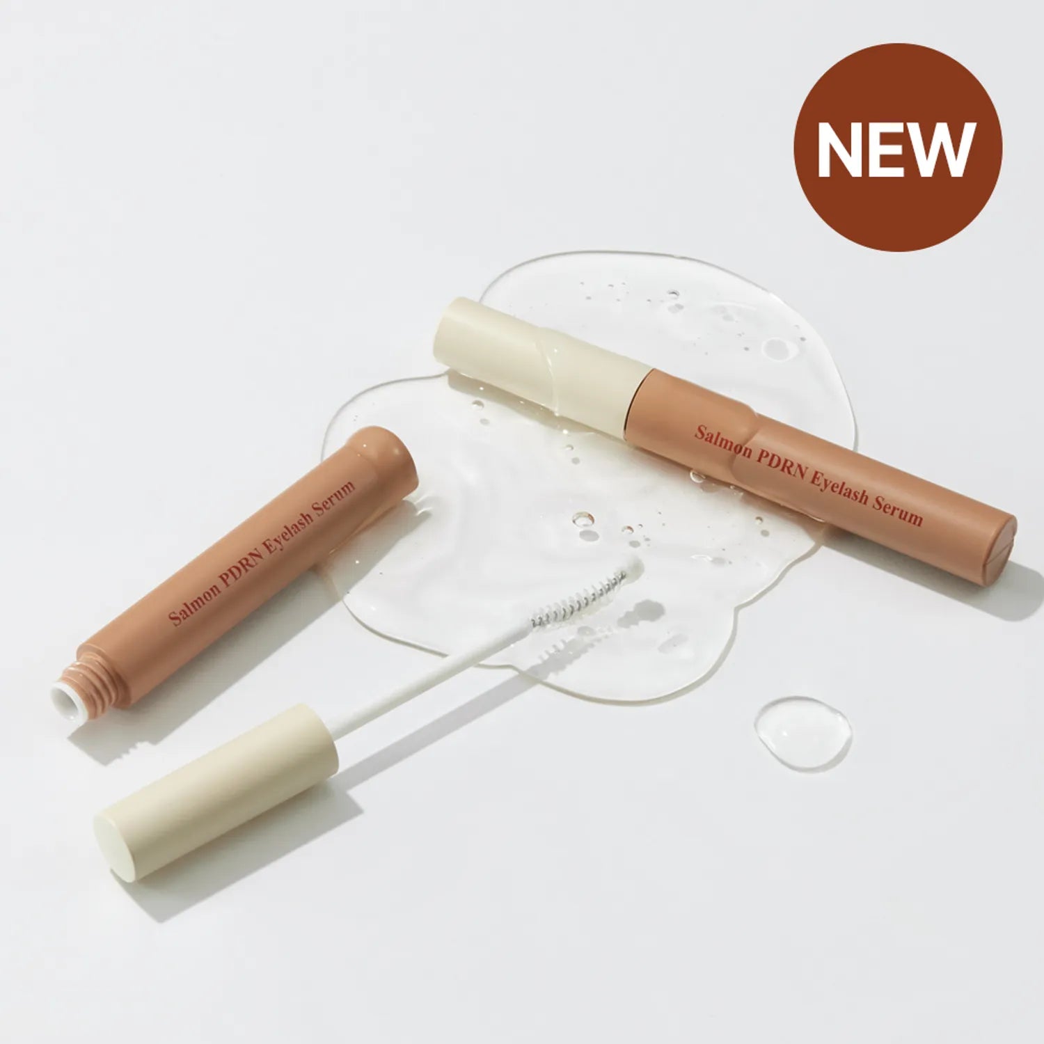 Two eyelash serum bottles with applicators on a white background, SKINFOOD Salmon PDRN Eyelash Serum asian authentic genuine original korean skincare montreal toronto calgary canada thekshop thekshop.ca natural organic vegan cruelty-free cosmetics kbeauty vancouver free shipping clean beauty routine skin makeup kpop stayz stan fandom photocard stray kids treasure ateez atiny dix30 brossard ddo royal mount st-bruno new store
