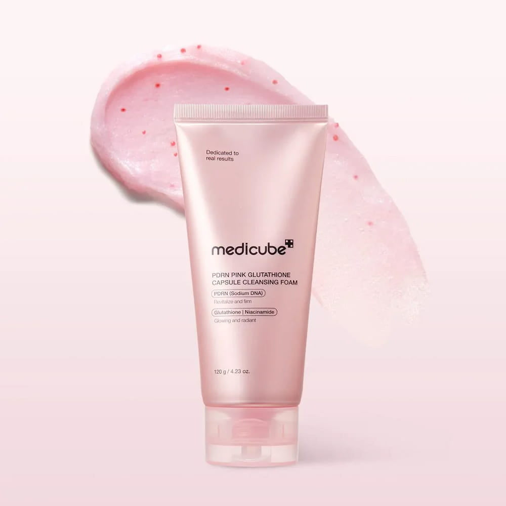  Medicube PDRN Pink Glutathione Capsule Cleansing Foam 120g is a multi-functional Korean facial cleanser designed to brighten, hydrate, and refine skin texture. It features a unique mask-to-foam texture that starts as a marshmallow-like cream and transforms into a dense foam to remove up to 98.98% of pore-clogging impurities.