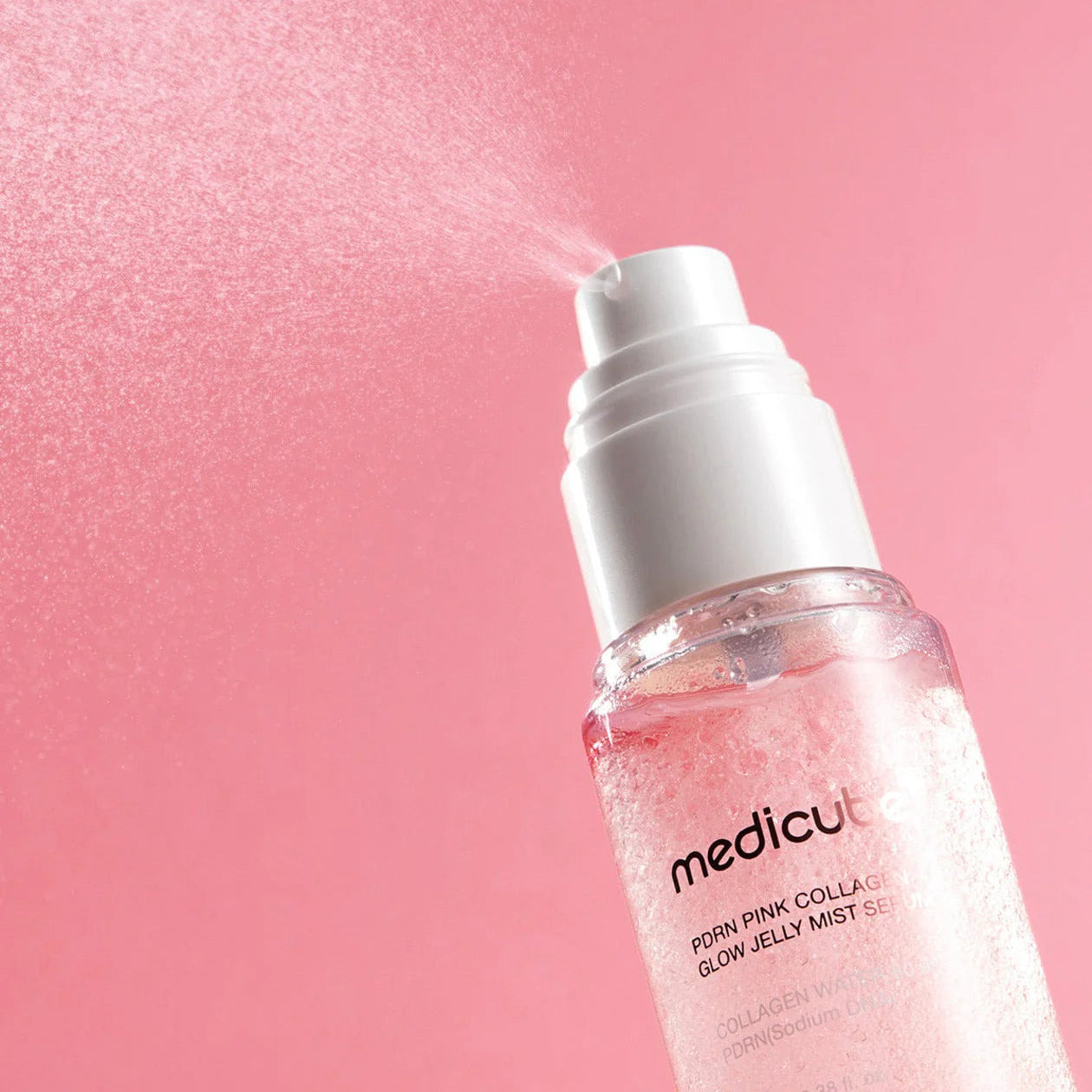 medicube PDRN Pink Collagen Glow Jelly Mist Serum 100ml Korean dual-texture glass-skin product that functions as both a serum and a hydrating mist. It is specifically designed to provide an instant dewy glow, deep hydration, and firming care.